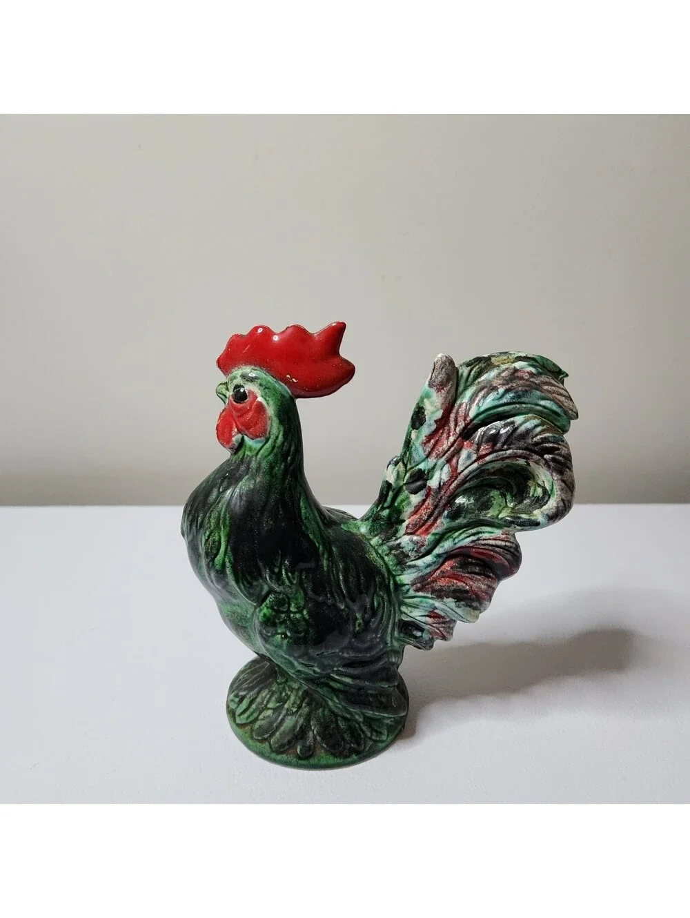 Green ceramic rooster figurine